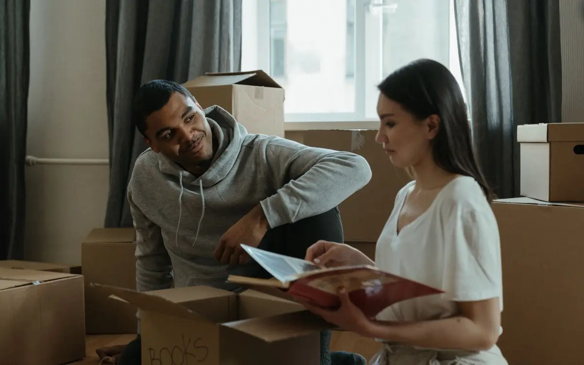 A couple unpacking boxes in their new home